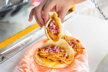 Cochinita pibil tacos with onion and habanero pepper at street stall