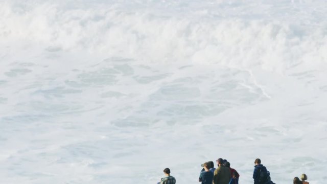 Aerial people watching big waves surfing Mavericks USA 