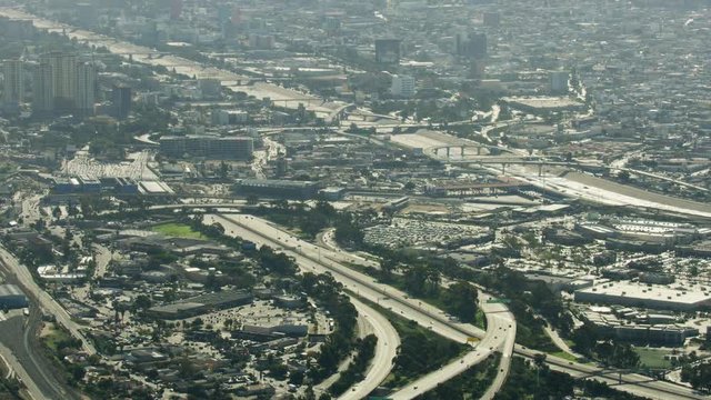 Aerial Los Angeles cityscape buildings river spillway California