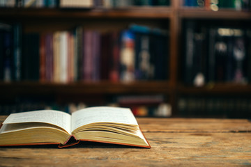 The book in the library (school, university, college) on the table. Learning and study concept. Copy space.