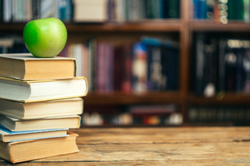 The book in the library (school, university, college) on the table. Learning and study concept. Copy space.