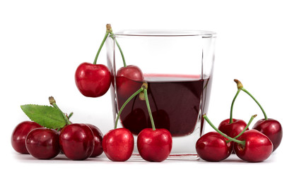 Cherry and glass of juice isolated on white background.