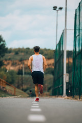 Man jogging on a racing track