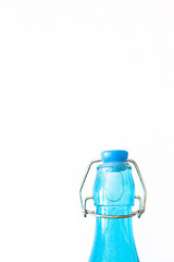 BLUE CRYSTAL BOTTLE ON WHITE BACKGROUND