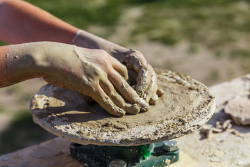 Production of a clay pot on a Potter's wheel.