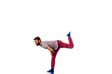 Young man dancing hip-hop at studio