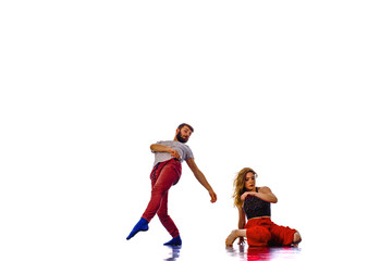 Dancing young couple on a white background