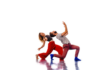 Fototapeta na wymiar Modern dancers in dynamic action isolated on white background