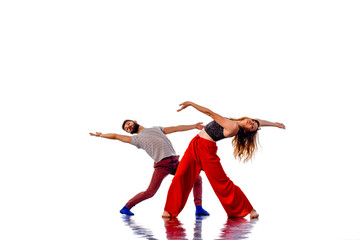 Gorgeous couple in studio, dancing portrait, isolated on white