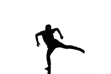 Fototapeta na wymiar Handsome dancer posing on a studio background