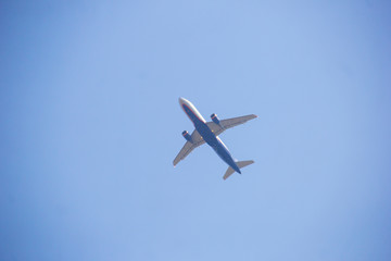 Plane in the sky leaving a trail