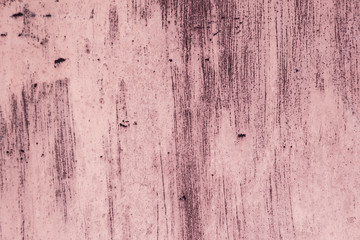 Old , rusty iron with paint residue. Pink background. Abstract color textures. Cracked texture.