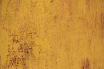 Obraz premium Tło zardzewiałe żelazo z pozostałościami kolorowej farby. Pomarańczowe tło.