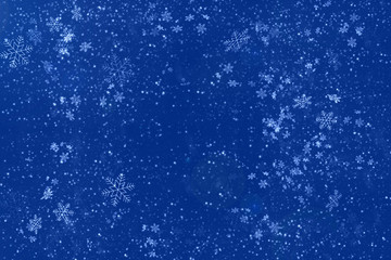 Blue abstract background with white snowflakes. Copy space. New year and Christmas celebration concept.
