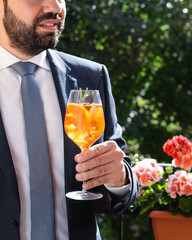 Fototapeta premium Man holding glass with italian aperol spritz