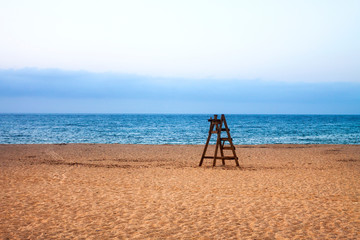 LANDSCAPE OF BEACH WITH STAIRS AND HORIZON OF SEA AND HEAVEN IN CADIZ, SPAIN