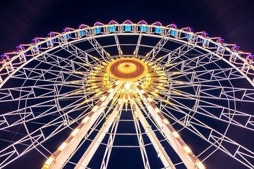ferris wheel  at night in the summer