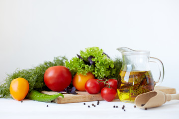 Composition with vegetables and spices on a table on a white background