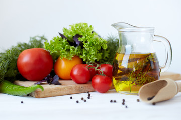 Composition with vegetables and spices on a table on a white background