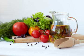 Composition with vegetables and spices on a table on a white background