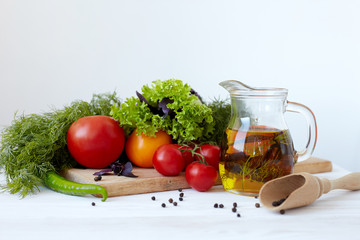 Composition with vegetables and spices on a table on a white background