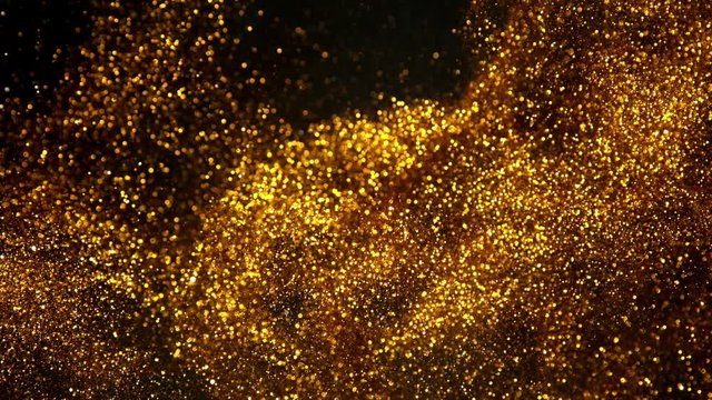 Super slow motion of glittering golden particles on black background. Shallow depth of focus. Filmed on high speed cinema camera, 1000 fps.
