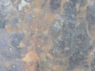 Rock heavily eroded by river water. Shifting colors and patterns. Background, overlay, or blending element.