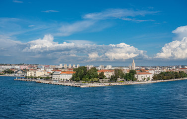 People on the promenade watching departure of cruise ship from the port of Zadar