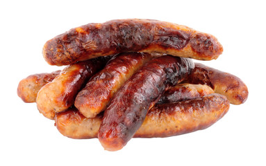Group of grilled chipolata sausages isolated on a white background