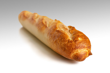 Fresh French baguette with a crispy crust on a light background