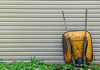 Lonely yellow wheelbarrow