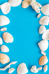 shells frame and seaside background for blog or desktop on blue table top view mockup