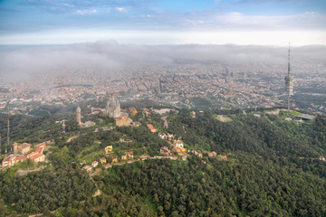 Aerial view above mountains with park overlooking city of Barcelona, Spain