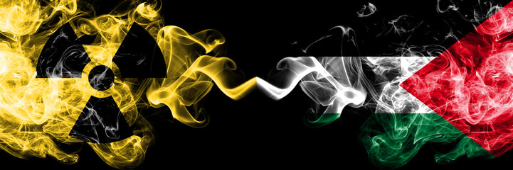 Palestine, Palestinian vs nuclear smoky mystic flags placed side by side. Thick colored silky smokes combination of Palestine, Palestinian flag and radioactive sign.
