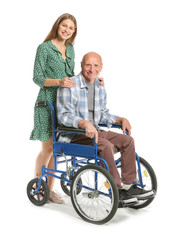 Handicapped elderly man with daughter on white background