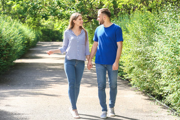 Obraz premium Happy young couple in park on summer day