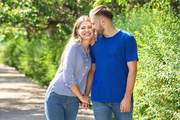 Obraz premium Happy young couple in park on summer day