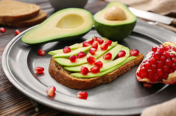 Tasty avocado toast on plate