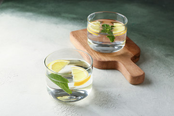 Glasses of fresh lemonade on table