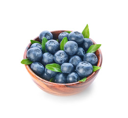 Bowl with ripe blueberry on white background