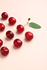Tasty ripe cherry on color background