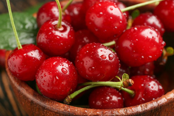 Tasty ripe cherry in bowl, closeup