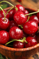 Tasty ripe cherry in bowl, closeup