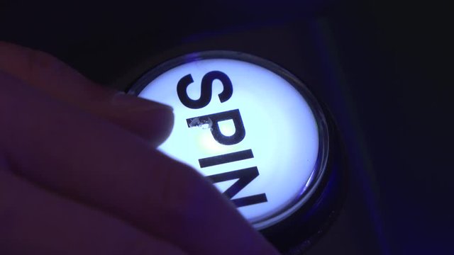 Pressing spin button on casino slot machine 4k