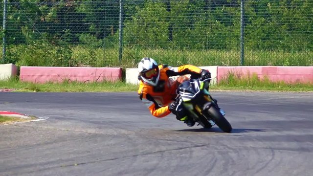 slow motion Motorcycle cornering on racing circuit