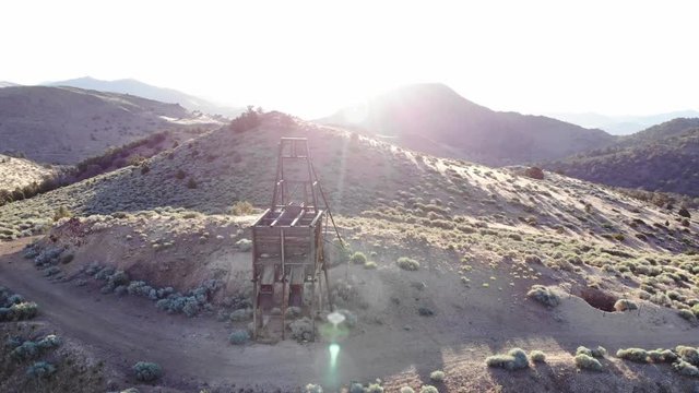 Orbiting Abandoned Gold Mine at Sunrise in Nevada Desert Near Virginia City - Aerial Drone.