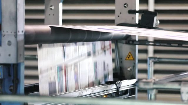 Printing press at typography for newspapers. Process of printing color newspapers.