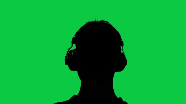 Green screen of man with headphones, silhouette