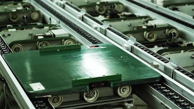 Roller Chains on Conveyor Belt at Computer Factory. Close Up.  