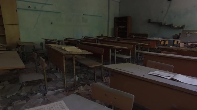 Empty classroom strewn with debris in Chernobyl exclusion zone, Pripyat